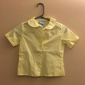 Girl’s yellow school uniform shirt